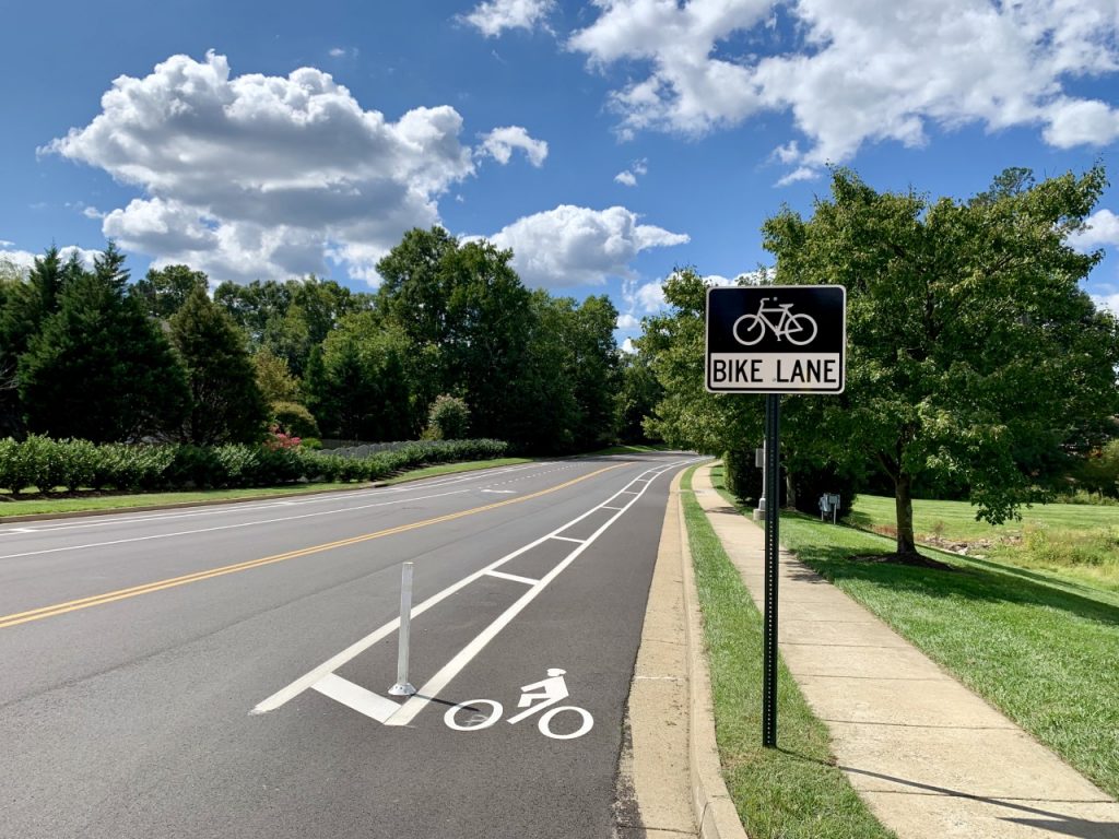 Photo of buffered bicycle lane with sign