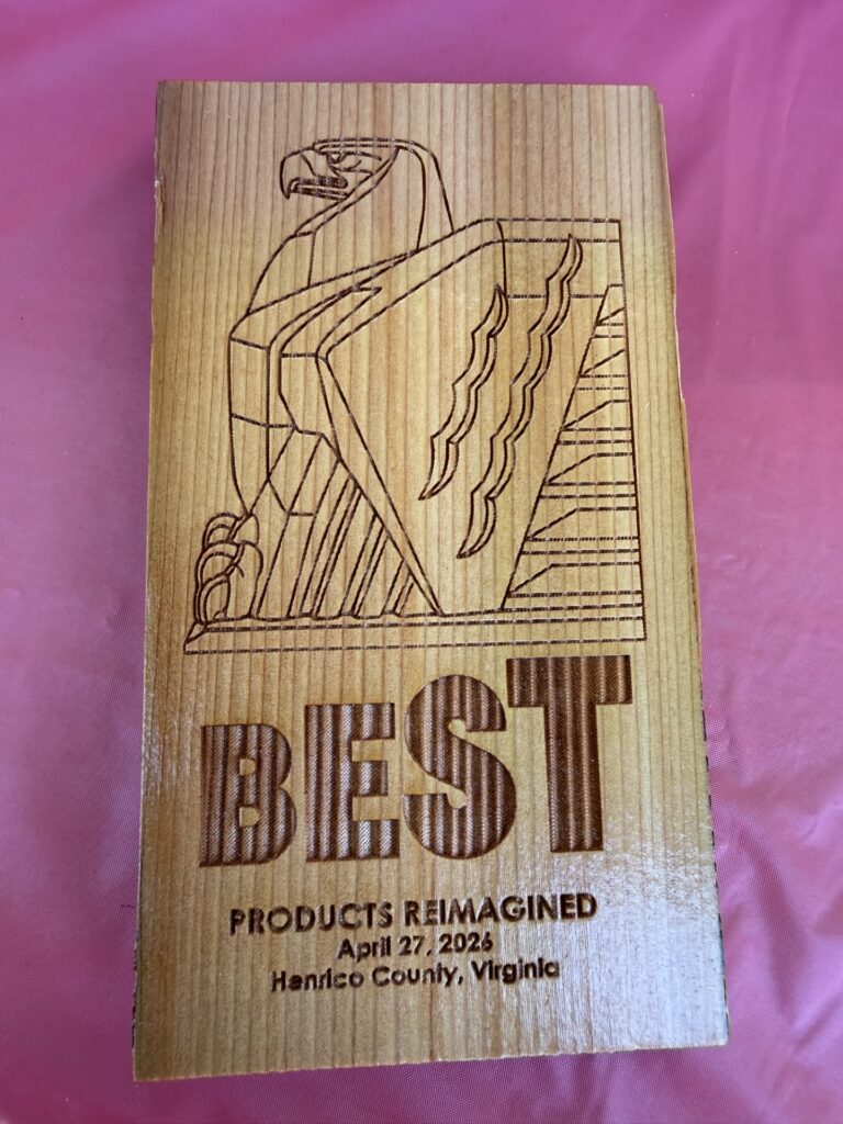 An engraved wood block with Best and an eagle